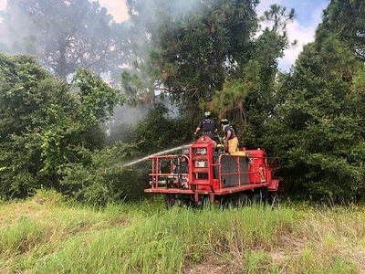 Brush truck dousing the fire 6.4.18