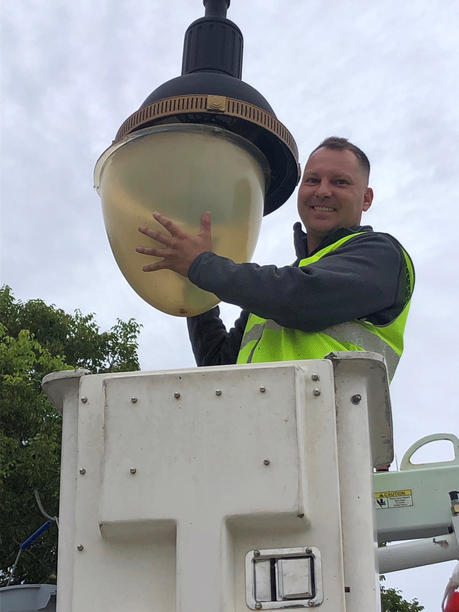 Lad Track repairing street light Nov 2021