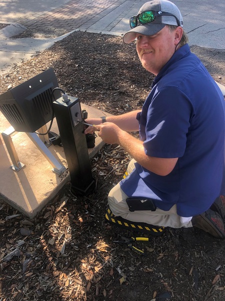 Chris Sommers rewiring the flag pole at Centennial park March 2022